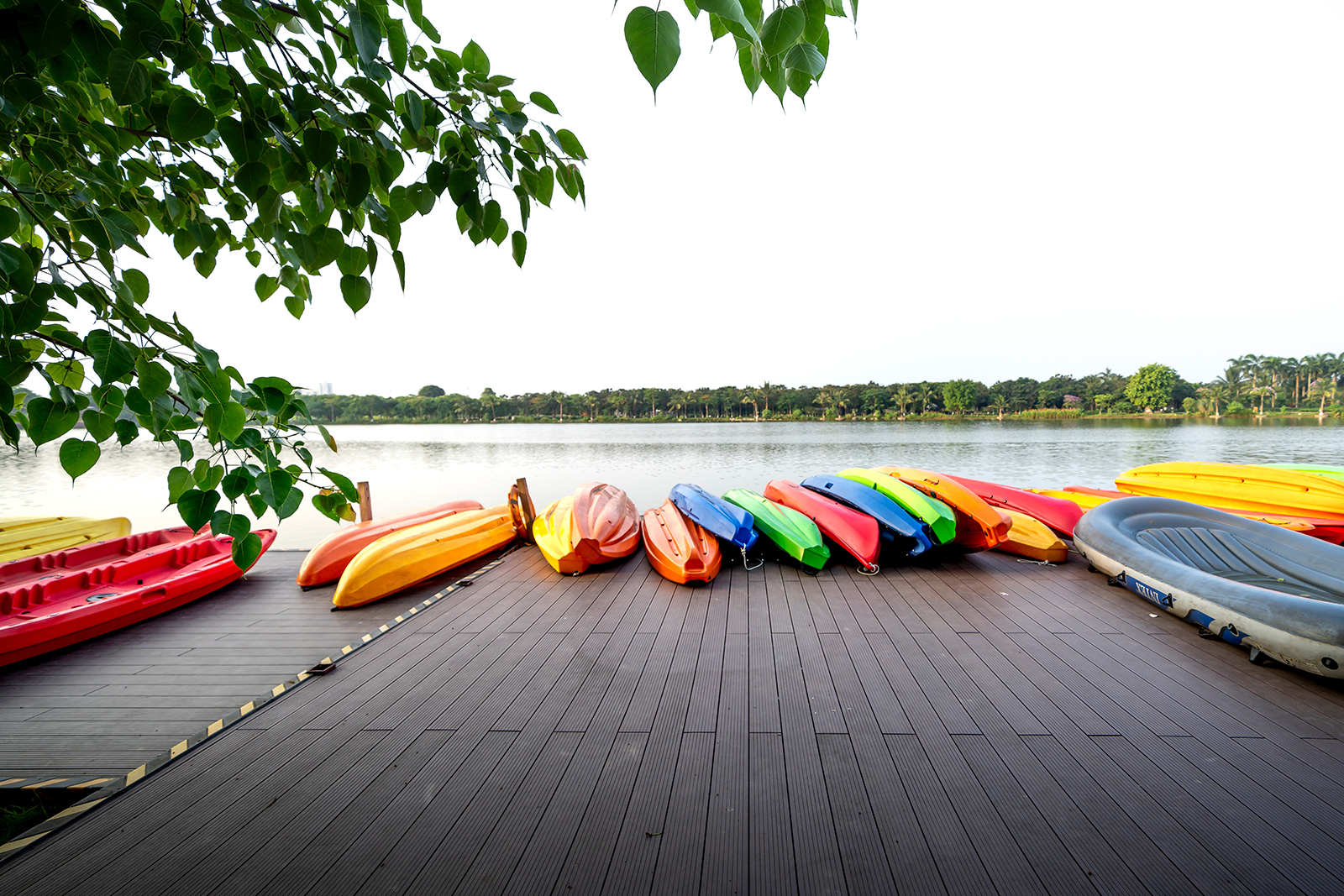 Colorful Canoes on Wooden Dock