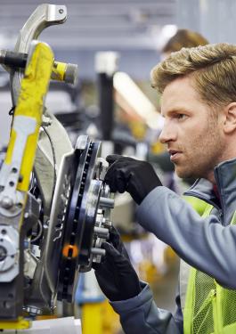 Man in safety vest in a production line