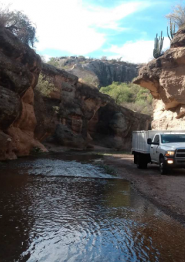 Truck driving through canyon