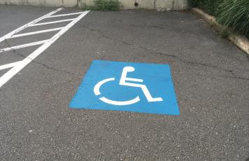 Handicap Space with blue painted marker on the ground